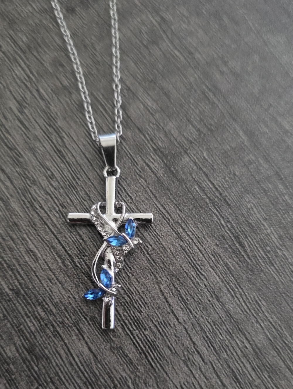 Silver Cross Pendant Necklace with Blue Crystal Accents